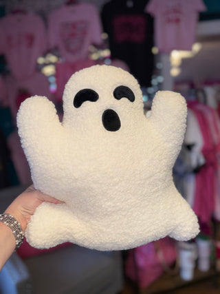 White ghost-shaped pillow with a soft, plush texture.