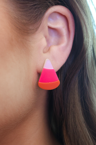 Purple candy corn dangle earrings made from acrylic and stainless steel.