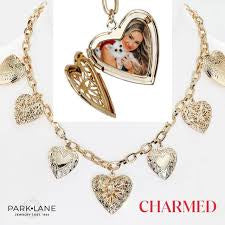 Gold-tone necklace with heart locket and multiple heart charms.