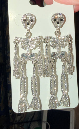 Metal skeleton earrings with a fish hook closure.