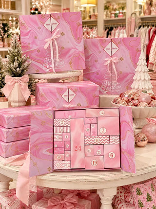 A pink advent calendar featuring 24 individually wrapped gifts.